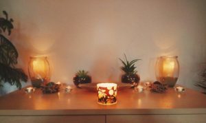 Candles and plants on altar meditation space