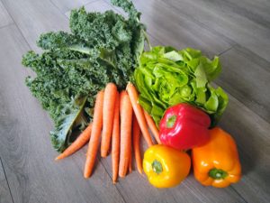 Carrots, lettuce, kale, and assorted peppers