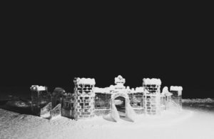 Ice castle on the frozen lake at night - Banff Ice Magic International Ice Carving Competition January 2020