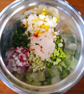 potatoe salad ingredients in a bowl